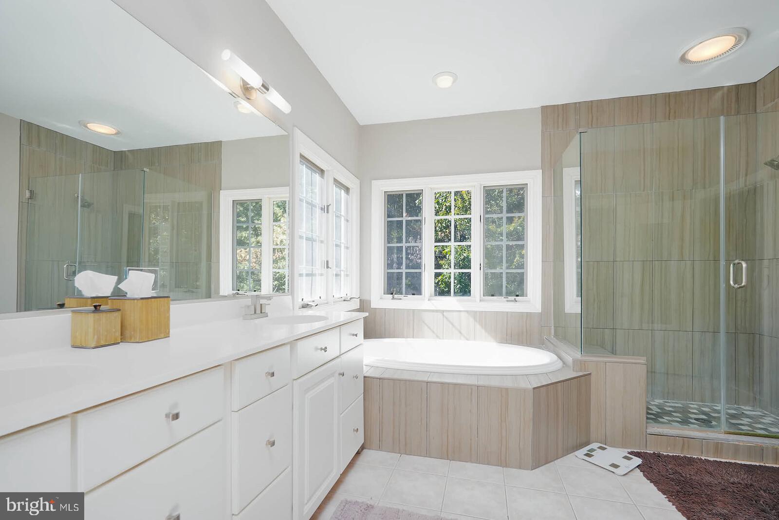 13014 English Turn Drive Silver Spring, MD 20904 - Photo 12 of 62 a bathroom with a tub sink and mirror