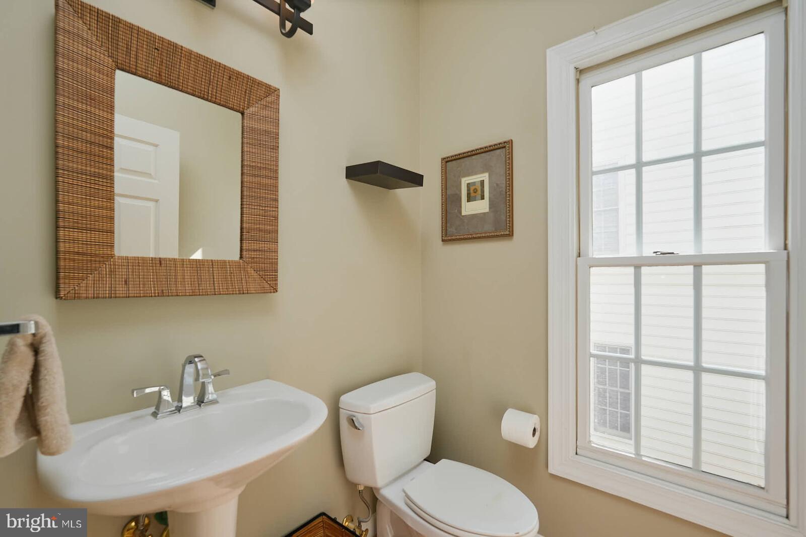 13014 English Turn Drive Silver Spring, MD 20904 - Photo 27 of 62 a bathroom with a toilet a sink and a mirror