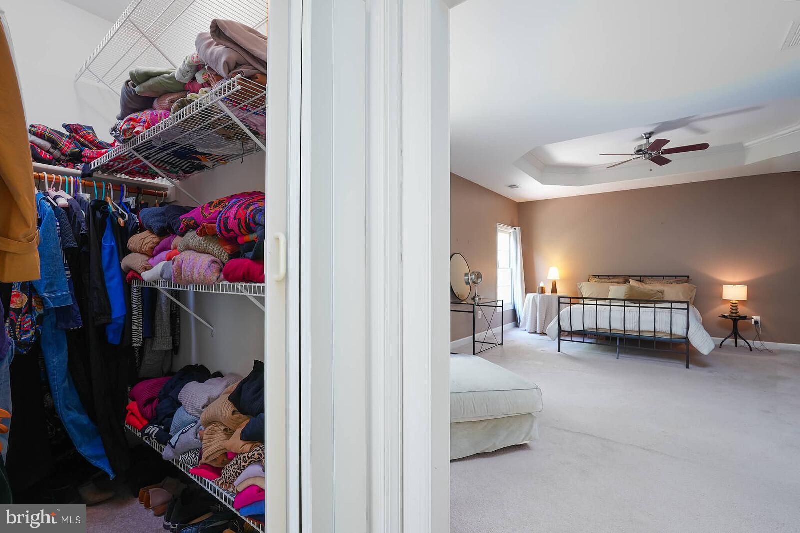 13014 English Turn Drive Silver Spring, MD 20904 - Photo 36 of 62 a view of walk in closet with clothes and shoes