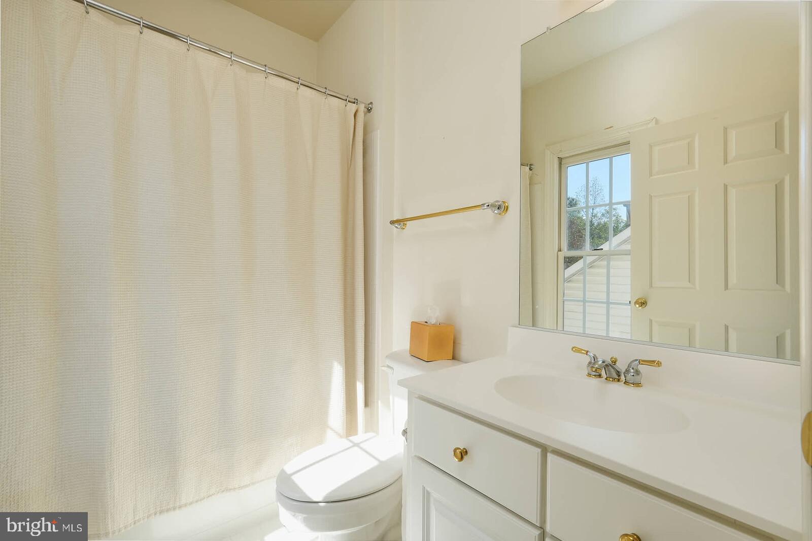 13014 English Turn Drive Silver Spring, MD 20904 - Photo 45 of 62 a bathroom with a sink a toilet and a mirror