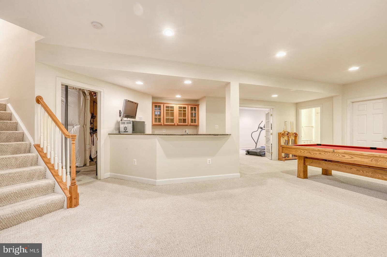 13014 English Turn Drive Silver Spring, MD 20904 - Photo 46 of 62 a view of an empty room with stairs and furniture