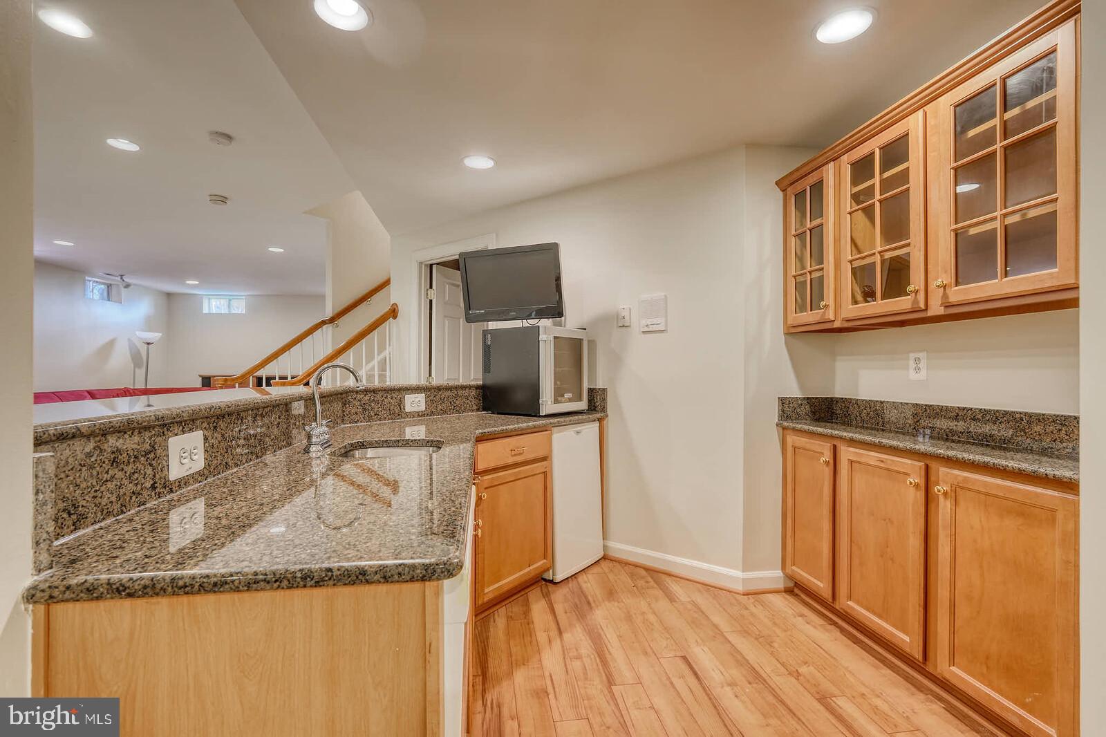 13014 English Turn Drive Silver Spring, MD 20904 - Photo 47 of 62 a kitchen with stainless steel appliances granite countertop a sink and a stove top oven