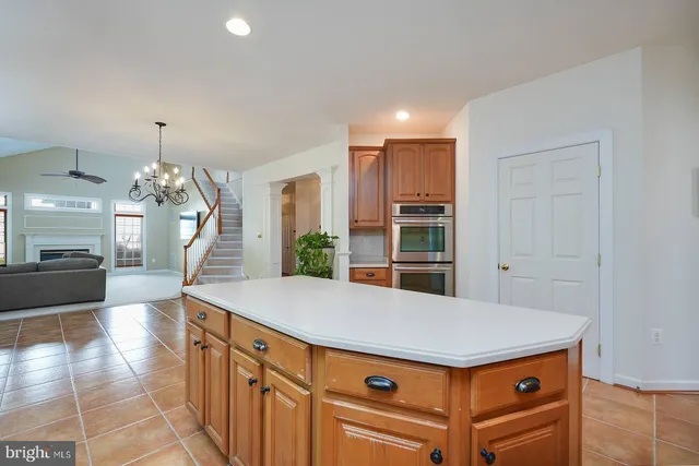a kitchen with stainless steel appliances granite countertop a refrigerator sink and cabinets