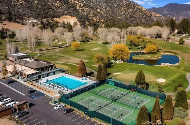 an aerial view of a houses with outdoor space