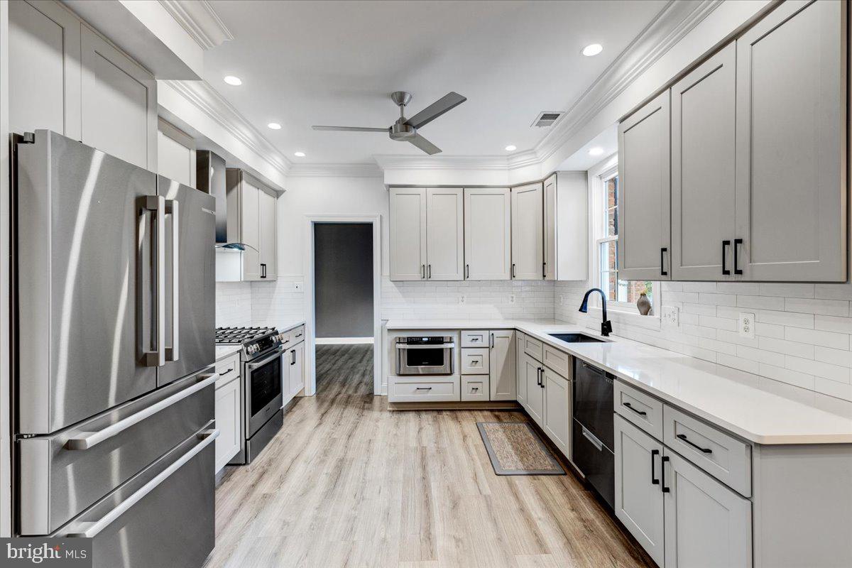 43501 Monarch Beach Square Leesburg, VA 20176 - Photo 13 of 43 a kitchen with a sink appliances and cabinets