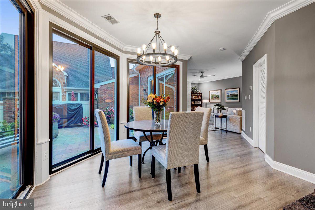 43501 Monarch Beach Square Leesburg, VA 20176 - Photo 17 of 43 a view of a dining room with furniture window and wooden floor