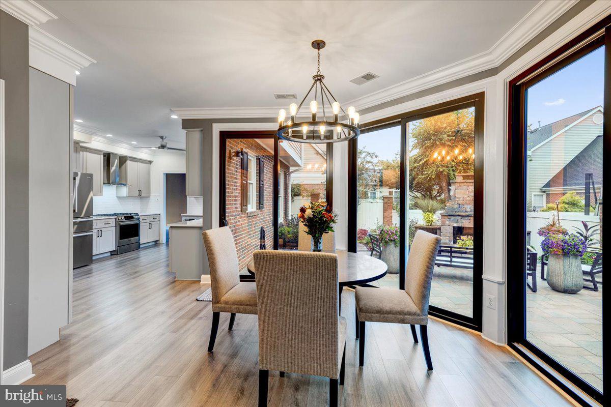 43501 Monarch Beach Square Leesburg, VA 20176 - Photo 18 of 43 a view of a dining room with furniture window and wooden floor