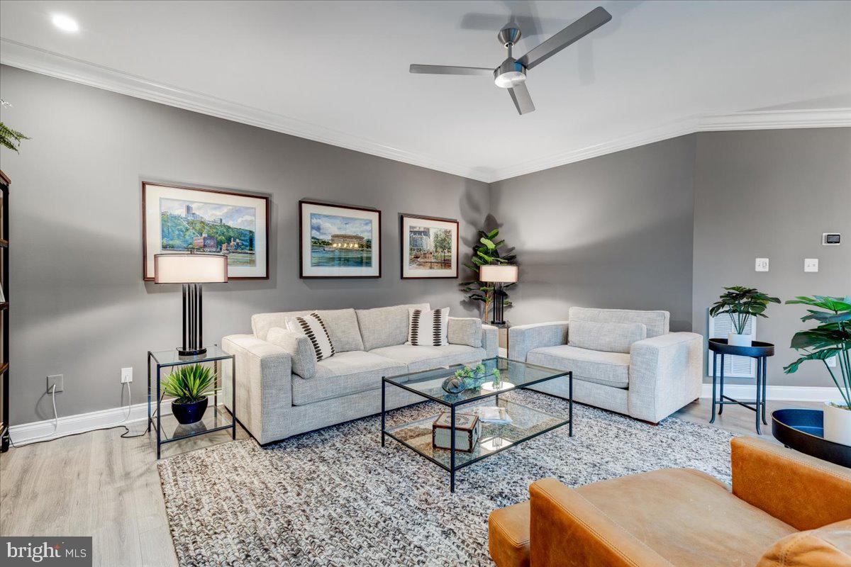 43501 Monarch Beach Square Leesburg, VA 20176 - Photo 20 of 43 a living room with furniture and a painting on the wall