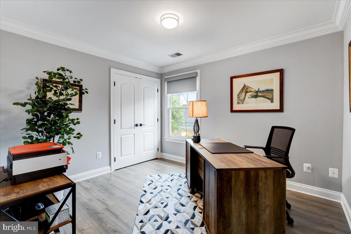 43501 Monarch Beach Square Leesburg, VA 20176 - Photo 28 of 43 a view of a workspace with furniture and wooden floor