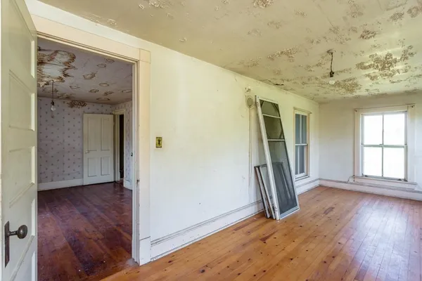 a room with furniture and a flat screen tv