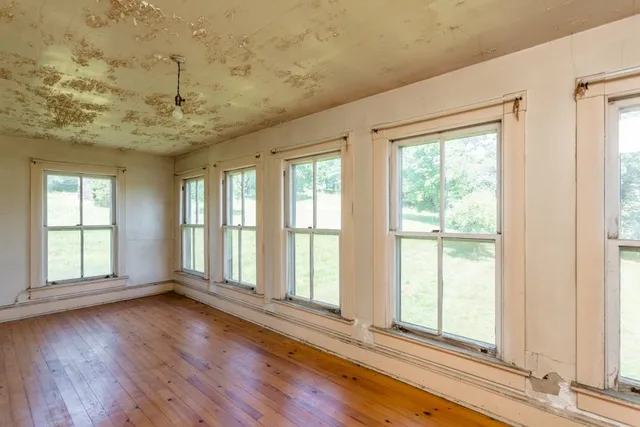 a room with furniture and a flat screen tv