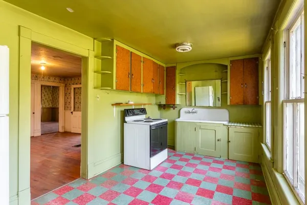 a kitchen with a sink and a refrigerator