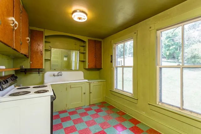 a room that has a stove and a window