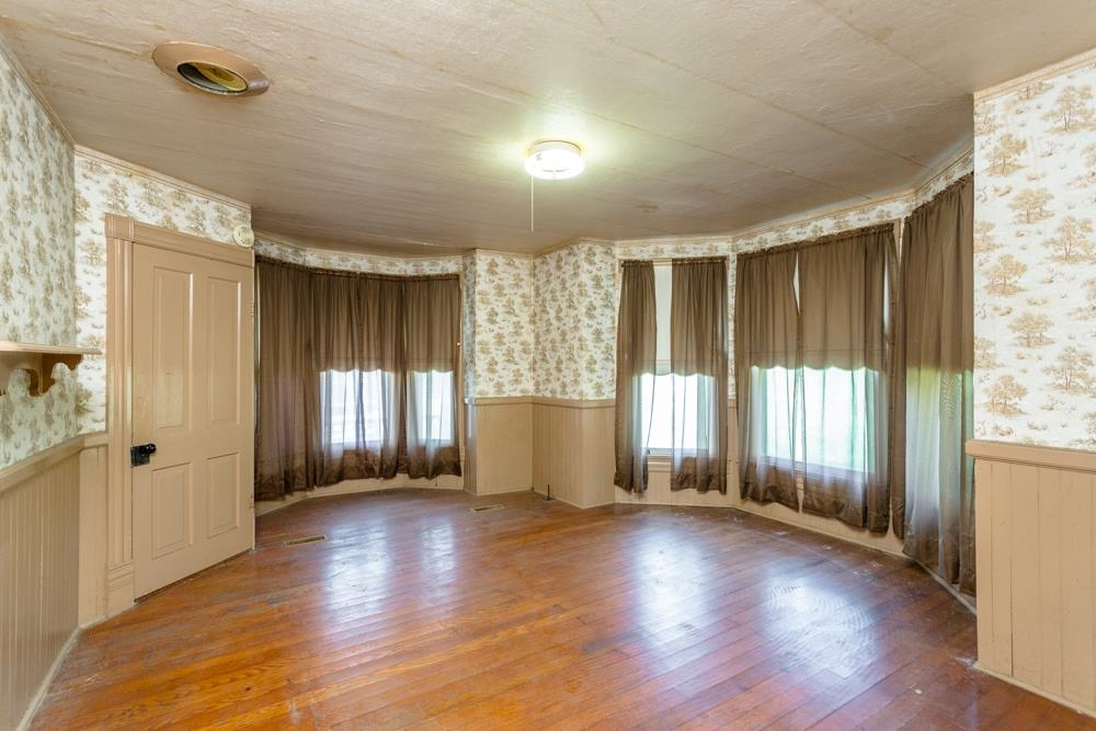 253 Church Street Timberville, VA 22853 - Photo 9 of 24 a view of a spacious bathroom with a large window and wooden floor