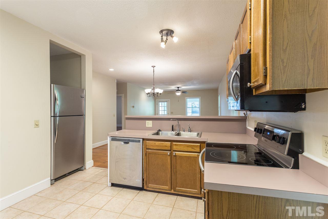 507 Pace Street Raleigh, NC 27604 - Photo 14 of 25 a kitchen with a sink a stove and refrigerator