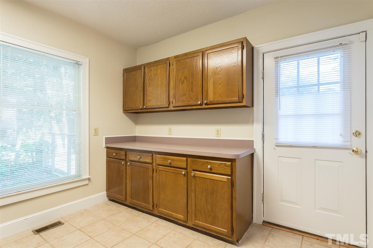 507 Pace Street Raleigh, NC 27604 - Photo 15 of 25 a view of a kitchen with wooden cabinet
