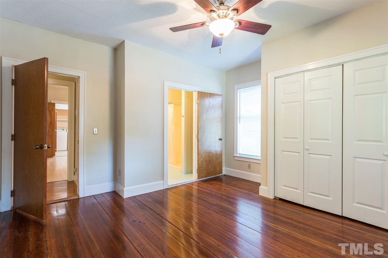 507 Pace Street Raleigh, NC 27604 - Photo 17 of 25 an empty room with wooden floor and a ceiling fan