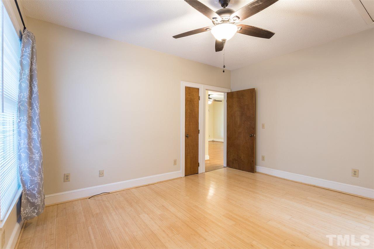 507 Pace Street Raleigh, NC 27604 - Photo 20 of 25 an empty room with closet and a chandelier fan