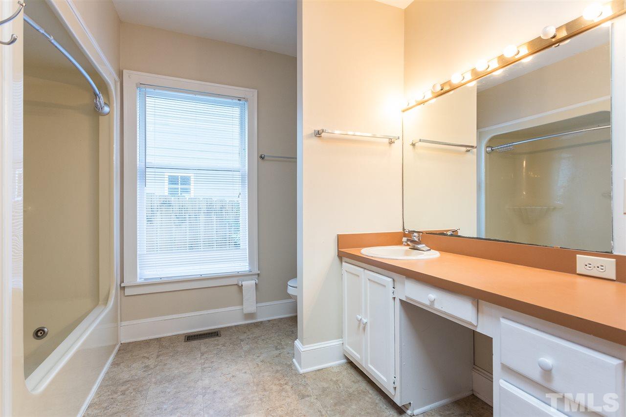 507 Pace Street Raleigh, NC 27604 - Photo 22 of 25 a bathroom with a sink and a mirror