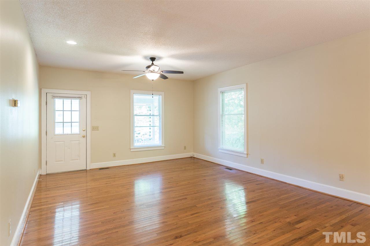 507 Pace Street Raleigh, NC 27604 - Photo 5 of 25 an empty room with wooden floor and window
