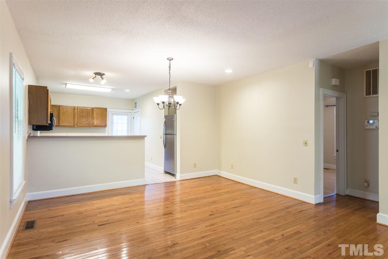 507 Pace Street Raleigh, NC 27604 - Photo 9 of 25 an empty room with wooden floor and windows