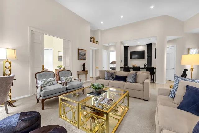 a kitchen with granite countertop a sink stove and cabinets