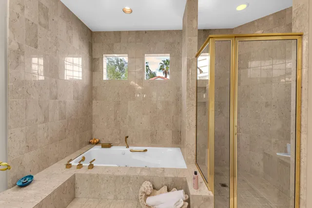 a view of a chair and tables in the patio