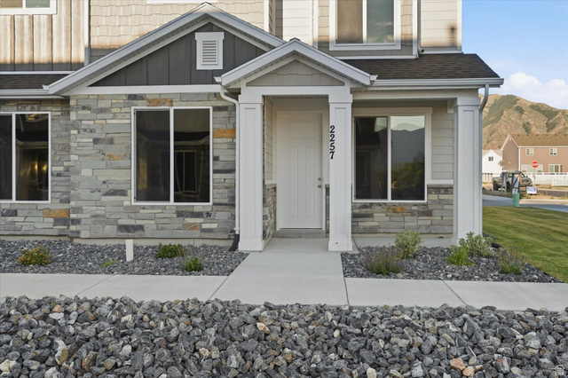 2257 South 1090 West, Unit 74 Nibley, UT 84321 - Photo 21 of 40 Multi-textured exterior featuring stone veneer, horizontal siding, and shingle accents