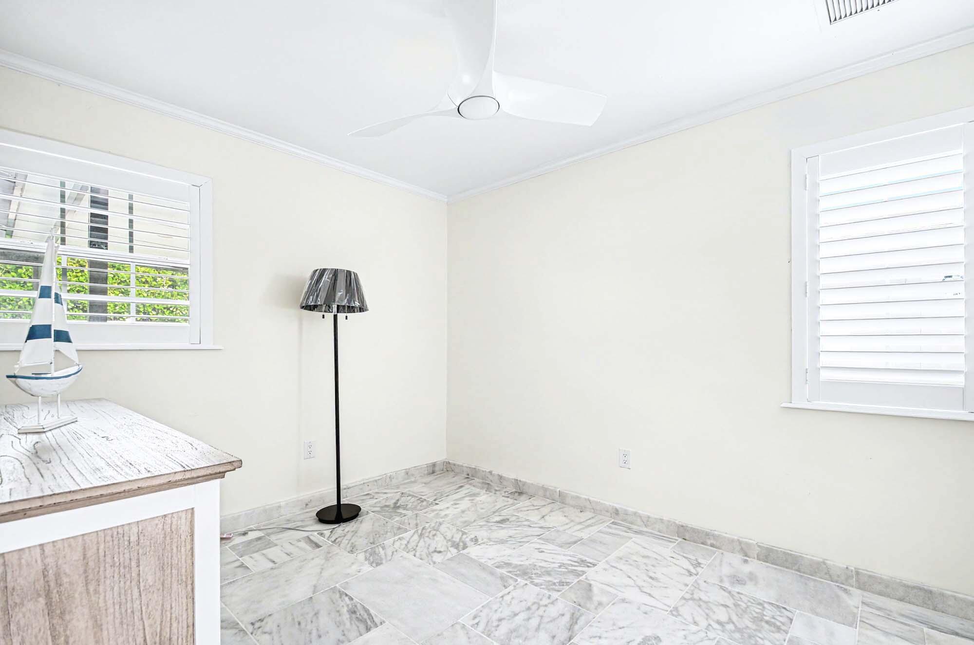 112 Capri Boulevard Naples, FL 34113 - Photo 20 of 29 a view of a storage & utility room with a window