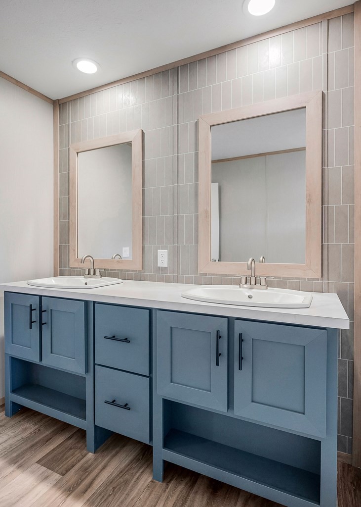 9107 Barnes Ridge Road Monroe, TN 38573 - Photo 14 of 30 a bathroom with double vanity sink and a mirror