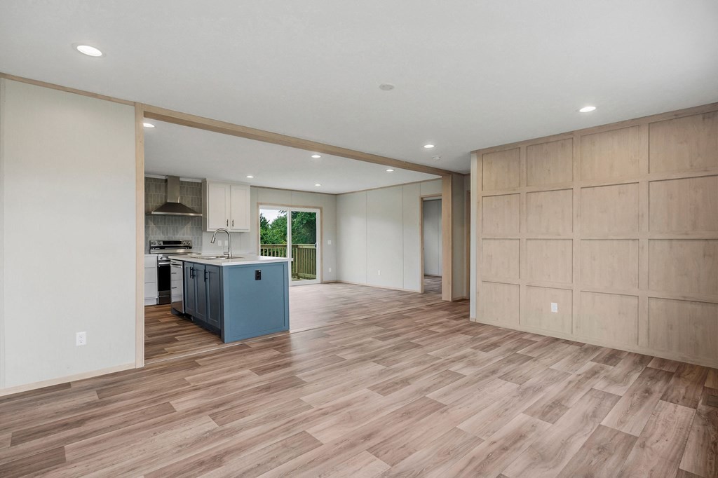 9107 Barnes Ridge Road Monroe, TN 38573 - Photo 21 of 30 a view of kitchen and empty room with wooden floor