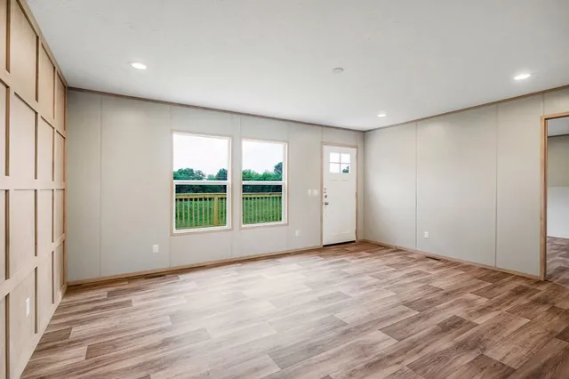 a view of an empty room with a window