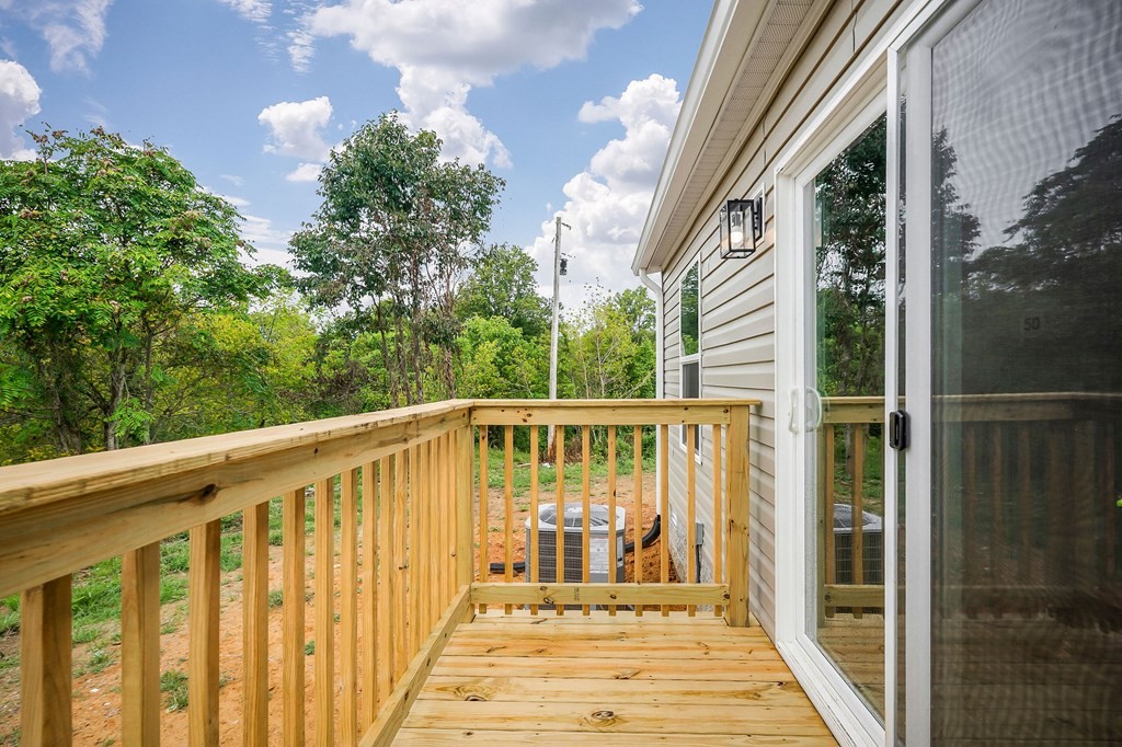 9107 Barnes Ridge Road Monroe, TN 38573 - Photo 27 of 30 a view of a balcony with wooden floor