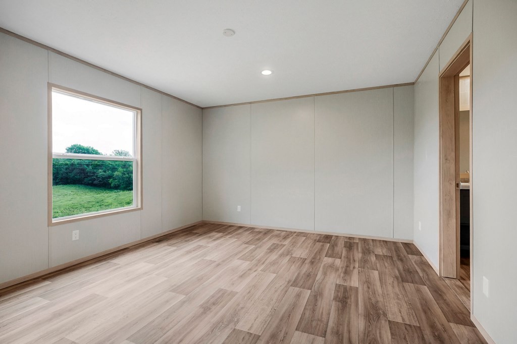 9107 Barnes Ridge Road Monroe, TN 38573 - Photo 7 of 30 a view of room with window and wooden floor