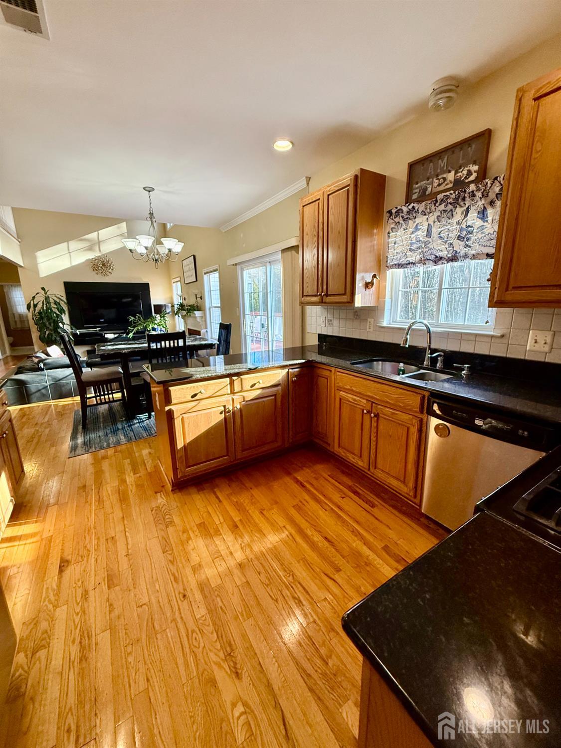 127 Disbrow Road Old Bridge, NJ 07747 - Photo 11 of 50 a kitchen with stainless steel appliances granite countertop a sink and cabinets