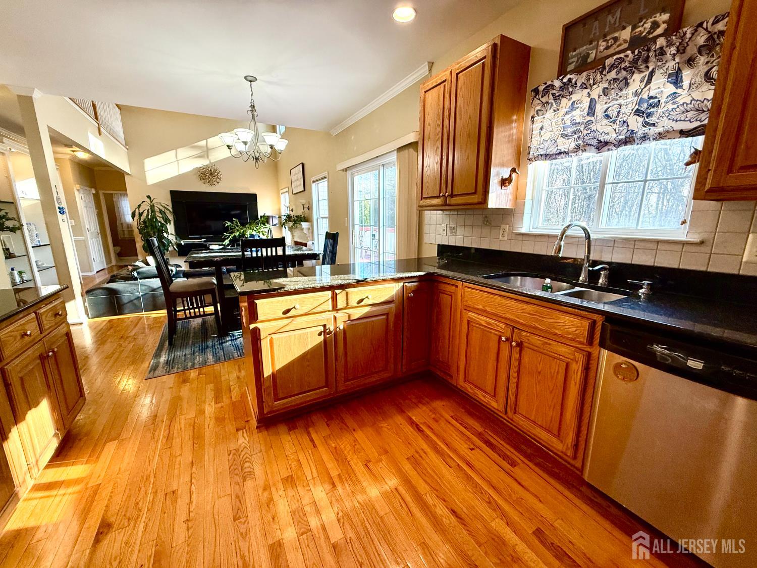 127 Disbrow Road Old Bridge, NJ 07747 - Photo 12 of 50 a kitchen with stainless steel appliances granite countertop a sink a stove cabinets counter space and a large window
