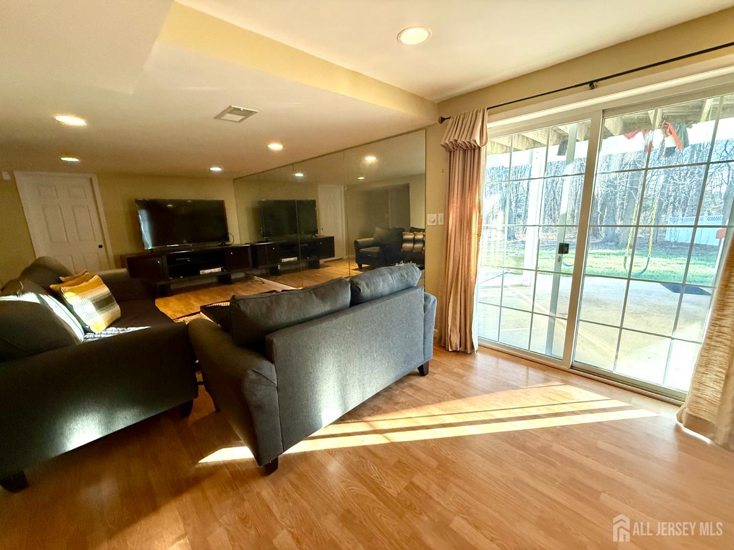 127 Disbrow Road Old Bridge, NJ 07747 - Photo 17 of 50 a living room with furniture and a large window