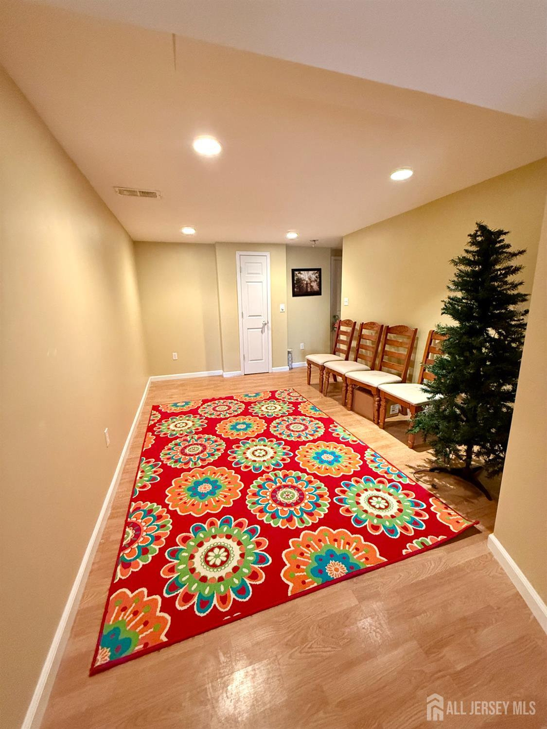 127 Disbrow Road Old Bridge, NJ 07747 - Photo 19 of 50 a large room with bed and a potted plant