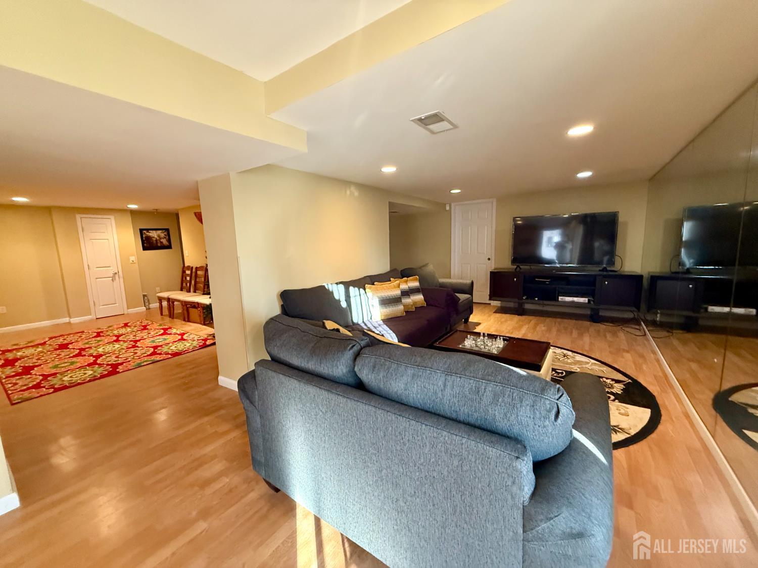 127 Disbrow Road Old Bridge, NJ 07747 - Photo 21 of 50 a living room with furniture and a wooden floor