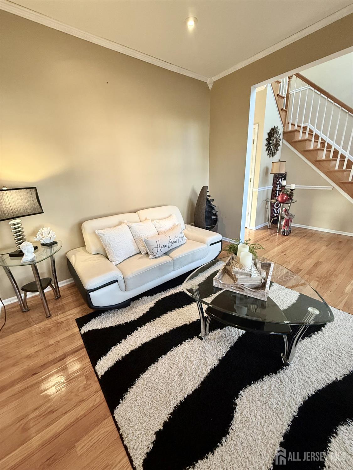 127 Disbrow Road Old Bridge, NJ 07747 - Photo 32 of 50 a living room with a couch and a table