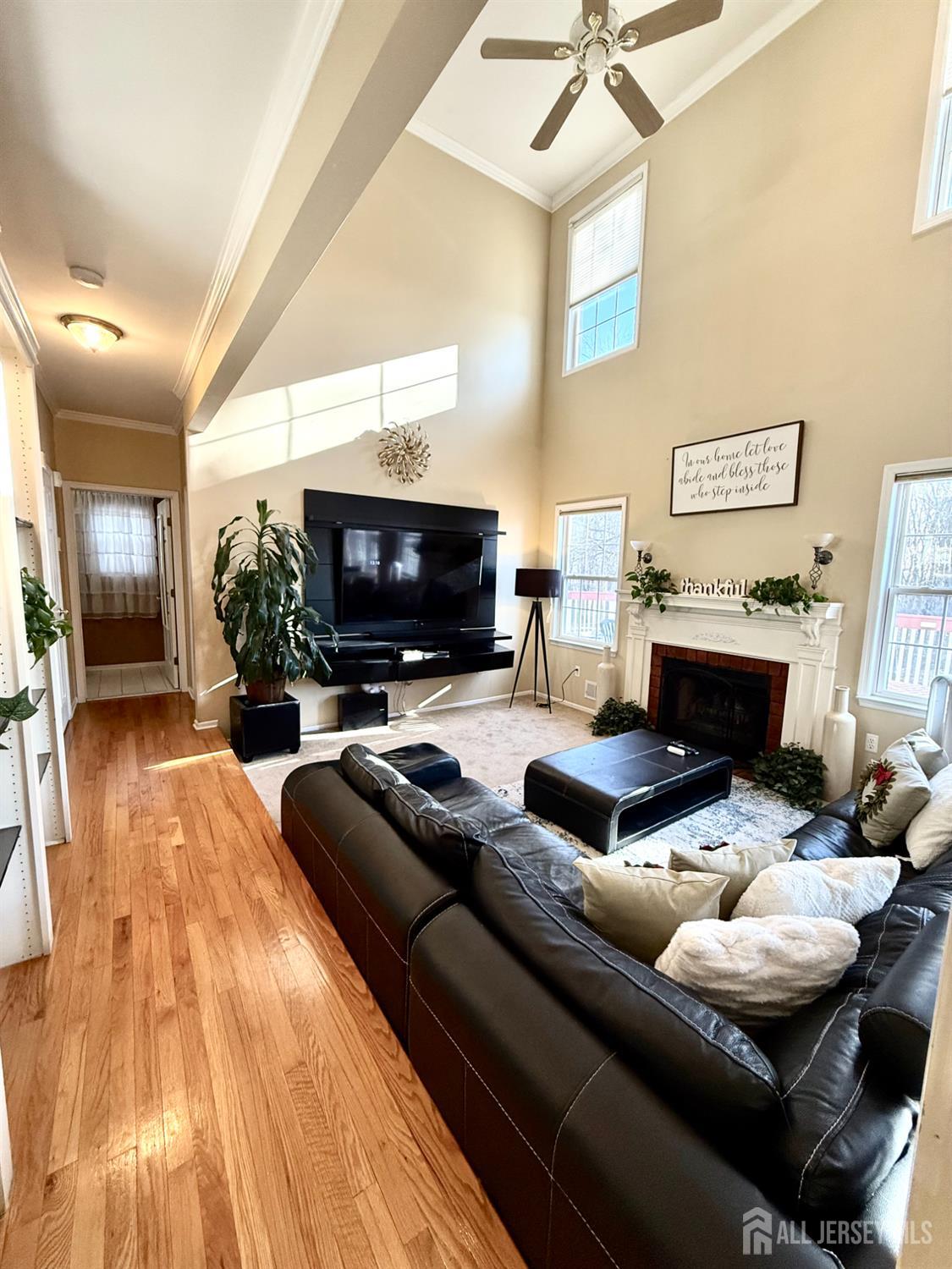 127 Disbrow Road Old Bridge, NJ 07747 - Photo 35 of 50 a living room with furniture and a fireplace