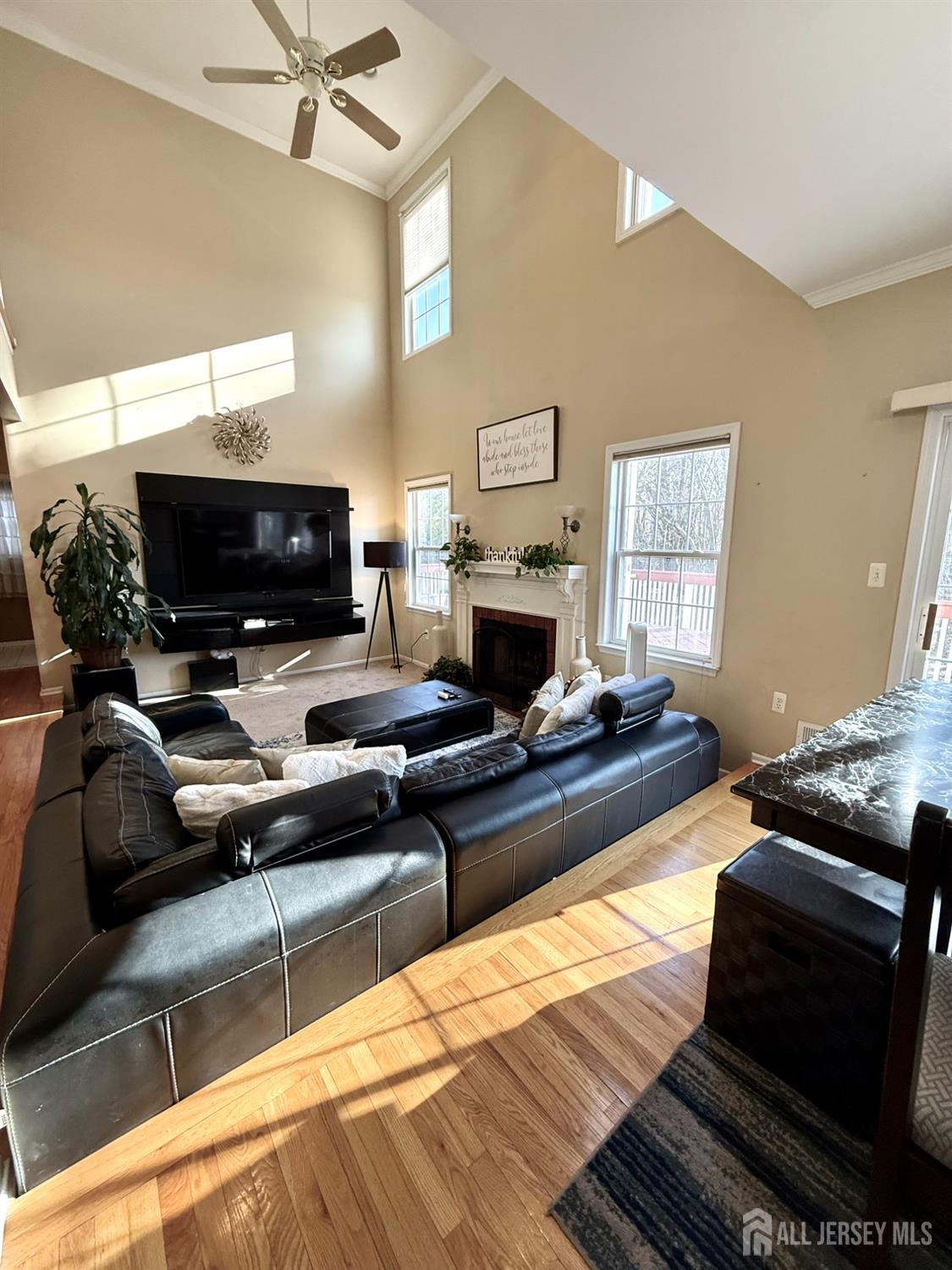 127 Disbrow Road Old Bridge, NJ 07747 - Photo 38 of 50 a living room with furniture and a flat screen tv