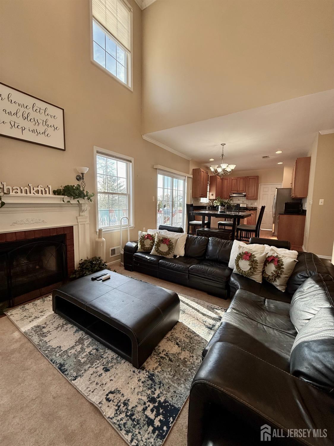 127 Disbrow Road Old Bridge, NJ 07747 - Photo 39 of 50 a living room with furniture and a fireplace