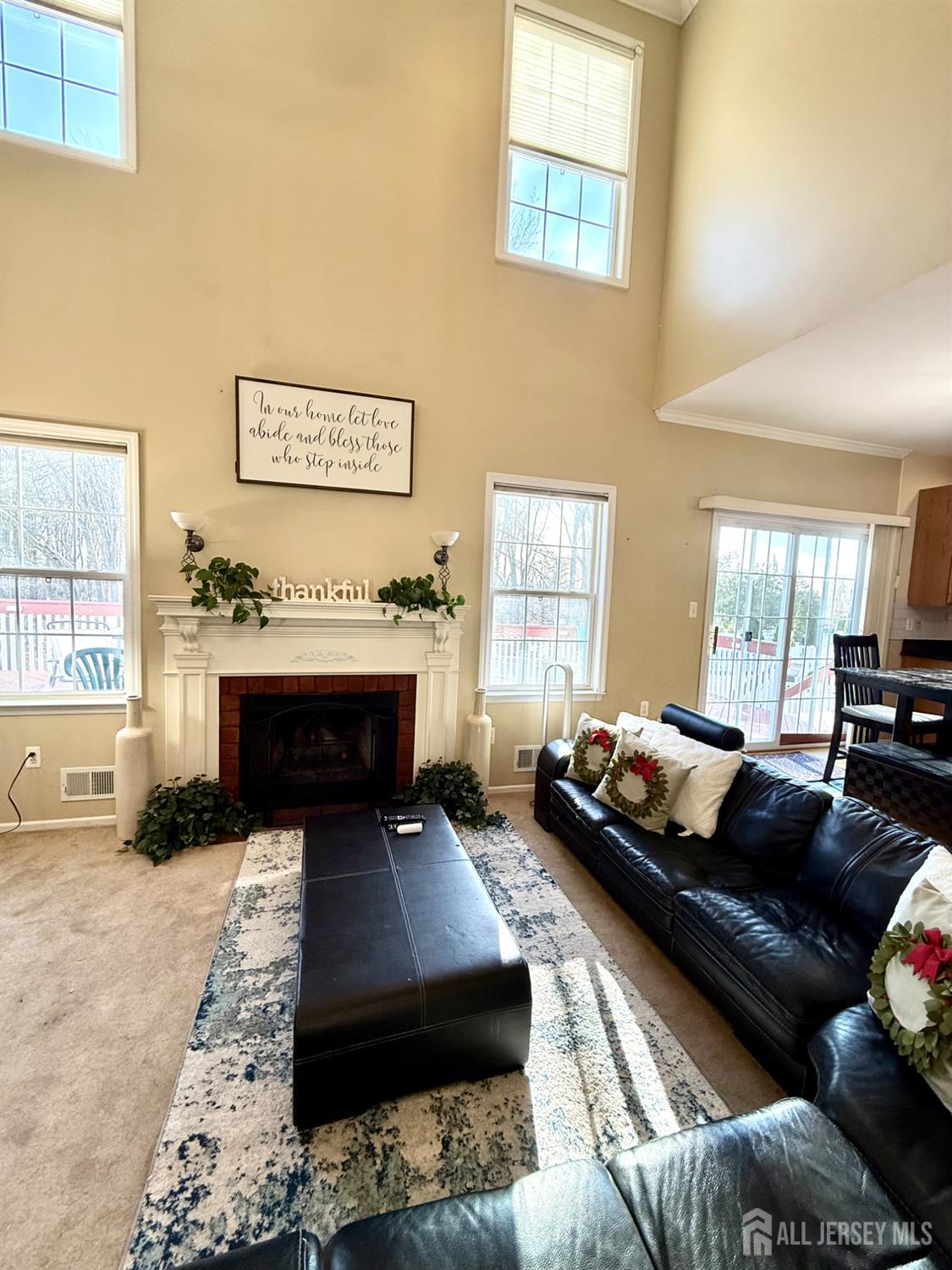 127 Disbrow Road Old Bridge, NJ 07747 - Photo 40 of 50 a living room with furniture and a fireplace