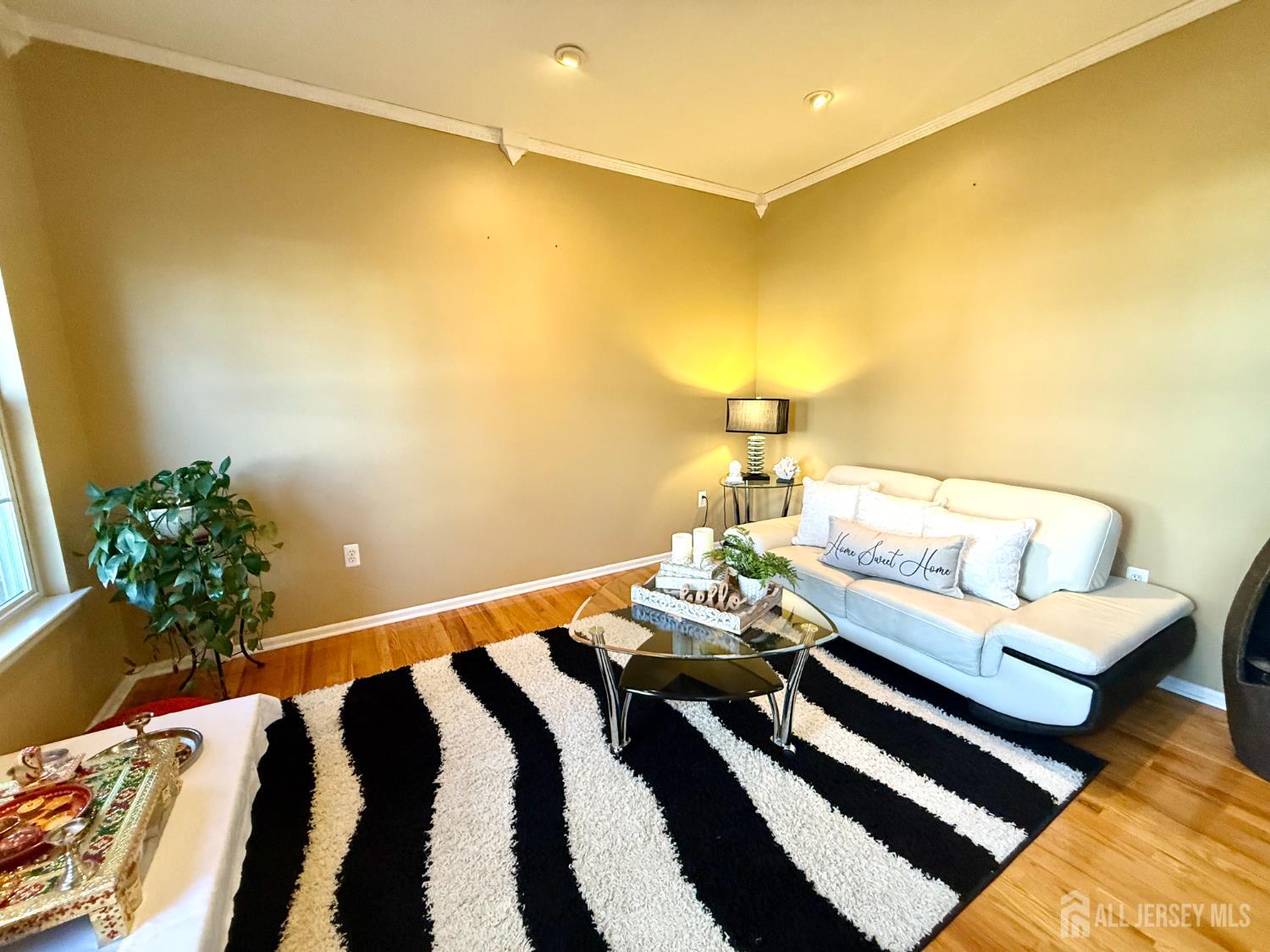 127 Disbrow Road Old Bridge, NJ 07747 - Photo 4 of 50 a bedroom with a bed and chandelier