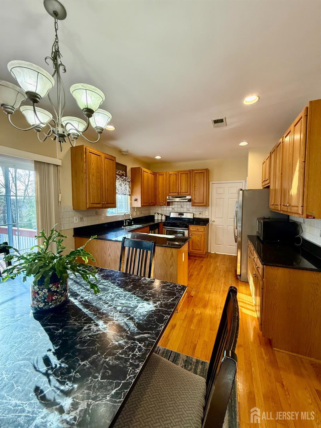 127 Disbrow Road Old Bridge, NJ 07747 - Photo 49 of 50 a kitchen with counter top space a sink and stainless steel appliances