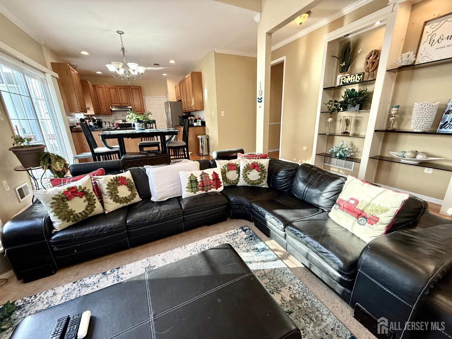 127 Disbrow Road Old Bridge, NJ 07747 - Photo 7 of 50 a living room with furniture and a chandelier