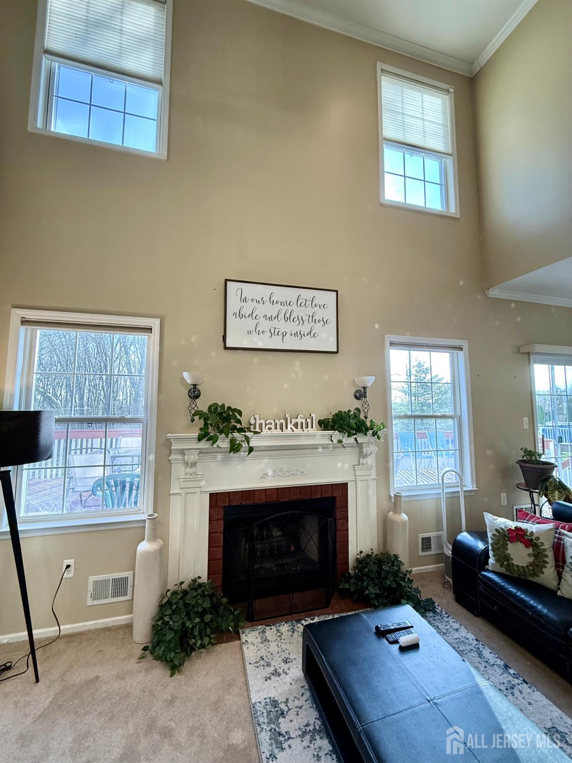 127 Disbrow Road Old Bridge, NJ 07747 - Photo 8 of 50 a living room with furniture and a fireplace