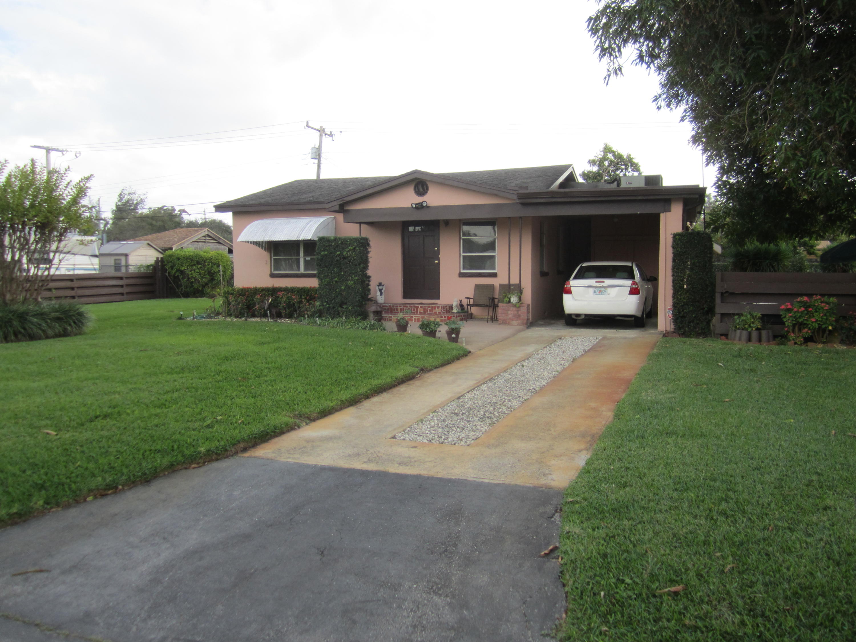 3058 Meadow Road Palm Springs, FL 33406 - Photo 1 of 11 Front