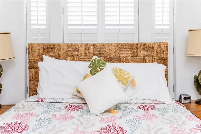 a bathroom with a granite countertop toilet sink and mirror
